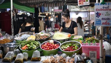 A market vendor accepting a QR code payment