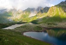 glacial lake beneath steep mountain peaks