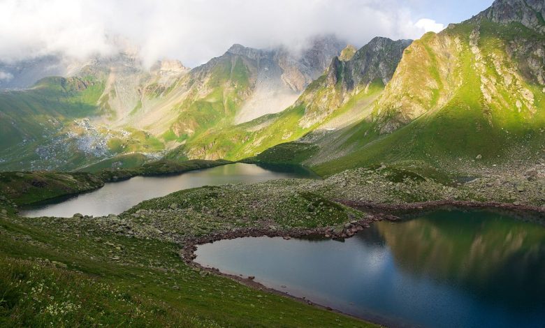 glacial lake beneath steep mountain peaks