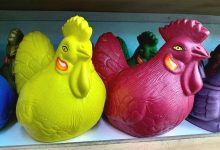 piggy bank surrounded by stacked coins